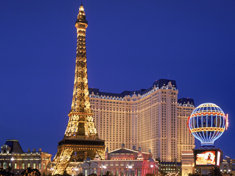 a large building with Paris Las Vegas in the background