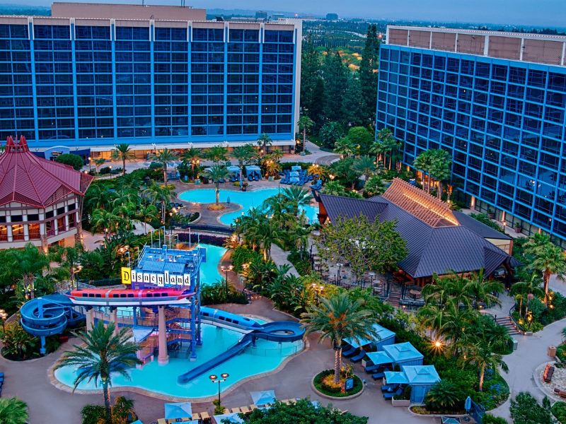 a pool and buildings in a resort